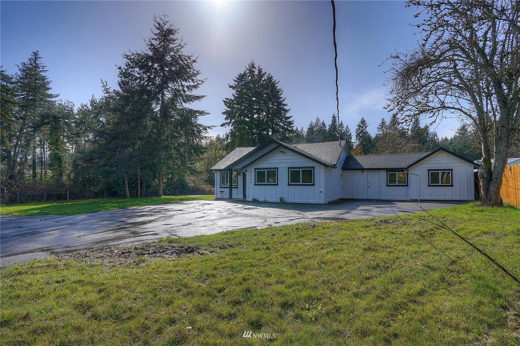 8126 Canyon Road East Puyallup, WA 98371 - Photo 7 of 37 a front view of a house with a yard