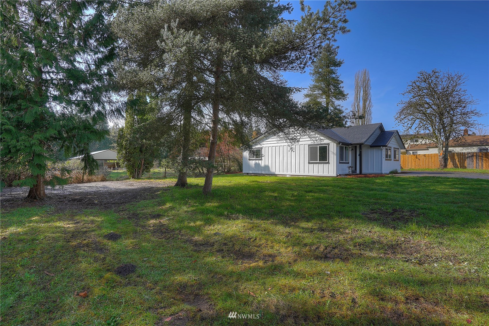 8126 Canyon Road East Puyallup, WA 98371 - Photo 9 of 37 a view of a house with a yard