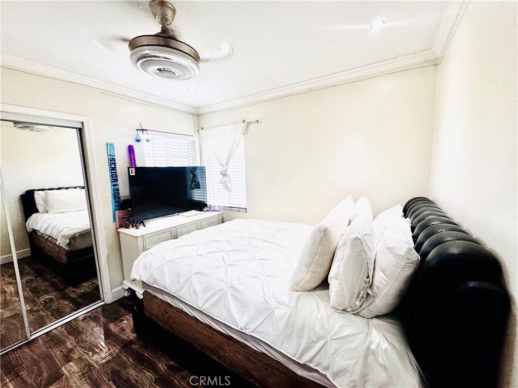 10152 Stanwin Avenue Arleta, CA 91331 - Photo 20 of 42 a bedroom with a bed and a television