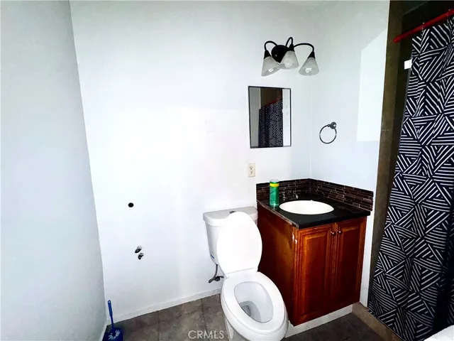 a bathroom with a toilet and a sink
