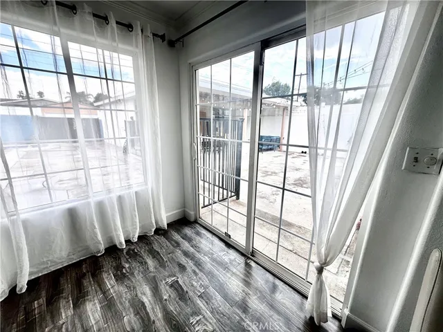 a view of a window with wooden floor