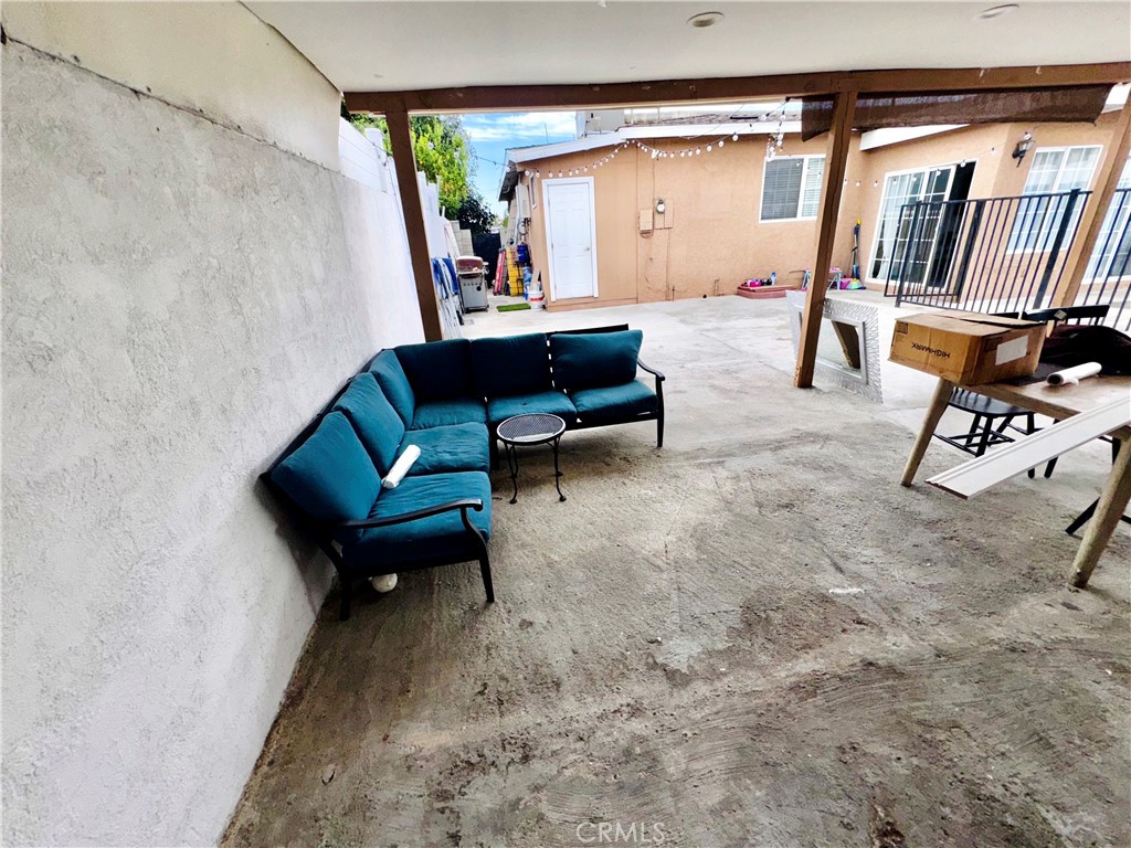 10152 Stanwin Avenue Arleta, CA 91331 - Photo 32 of 42 a living room with furniture and a rug