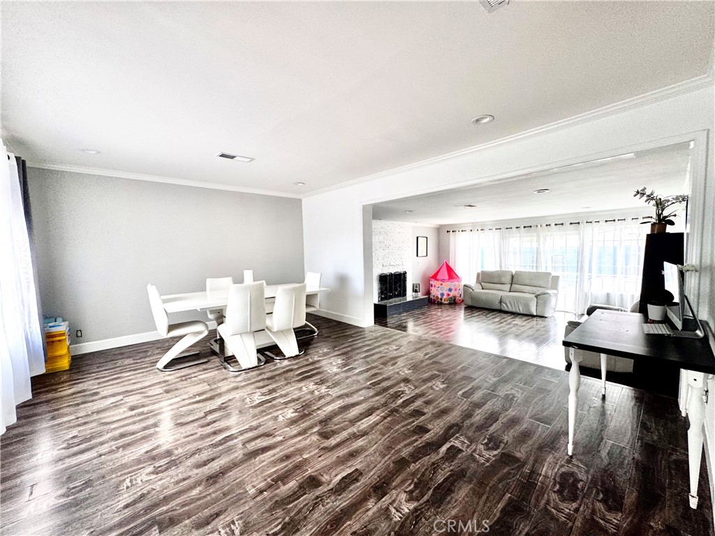 10152 Stanwin Avenue Arleta, CA 91331 - Photo 6 of 42 a living room with furniture and a wooden floor
