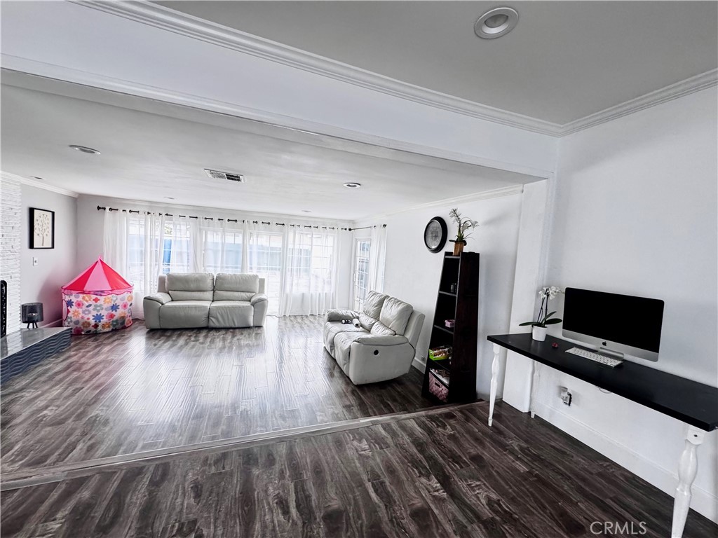 10152 Stanwin Avenue Arleta, CA 91331 - Photo 7 of 42 a living room with furniture and a flat screen tv
