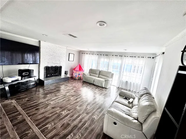 a living room with furniture or couch and a fireplace