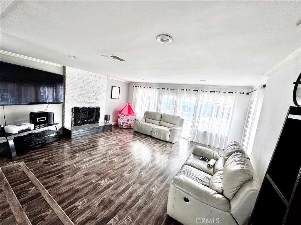 10152 Stanwin Avenue Arleta, CA 91331 - Photo 9 of 42 a living room with furniture or couch and a fireplace