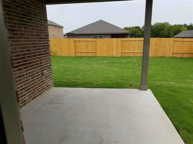 a view of swimming pool with a yard