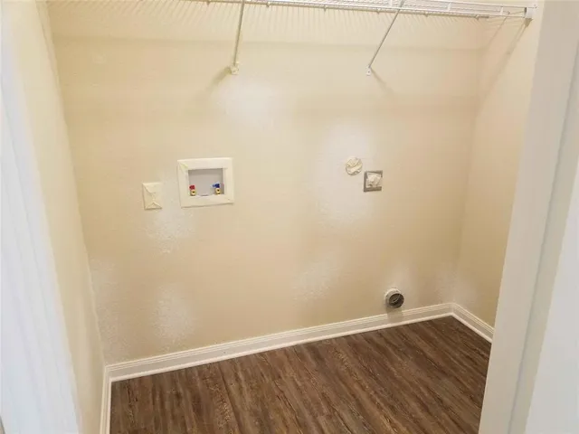 a view of a small space with wooden floor