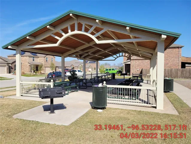 a view of a backyard with sitting area