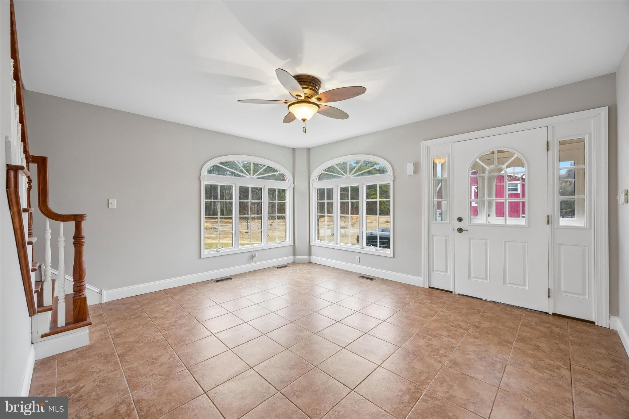 883 Atsion Road Shamong, NJ 08088 - Photo 23 of 42 a view of an empty room with a window and a ceiling fan