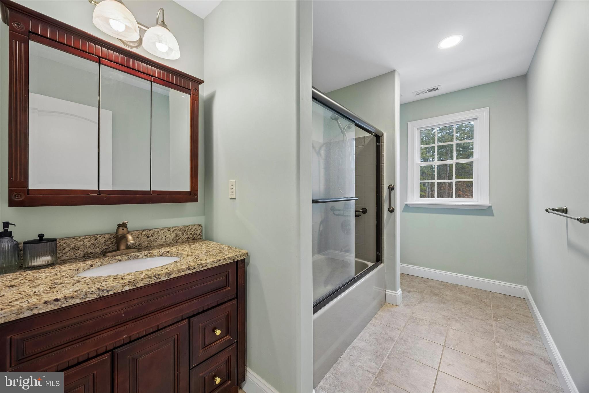 883 Atsion Road Shamong, NJ 08088 - Photo 31 of 42 a bathroom with a granite countertop sink and a mirror