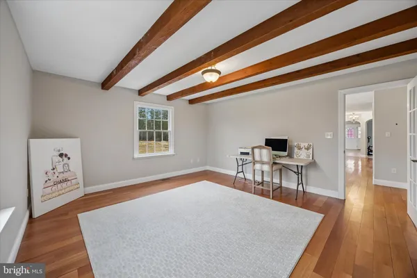 a workspace with furniture and wooden floor