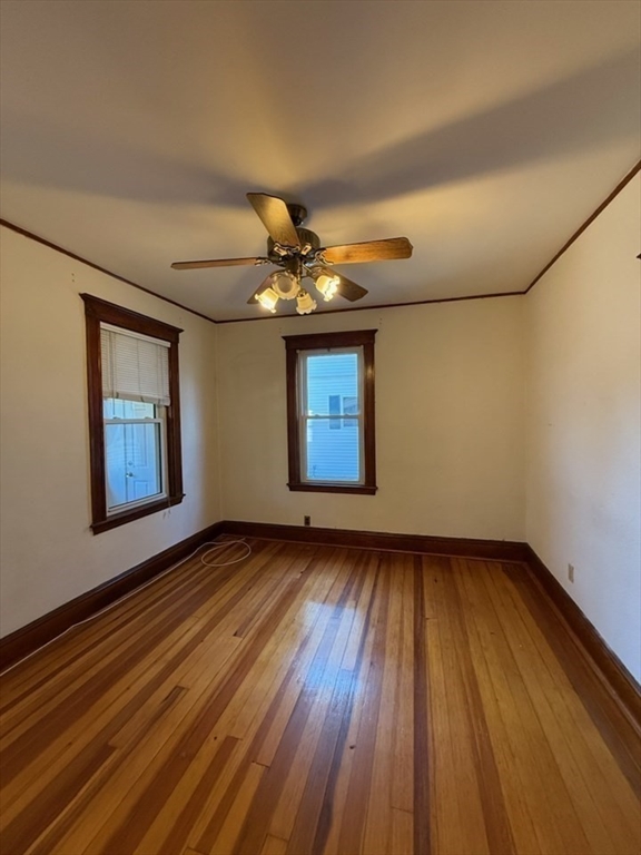 55-57 Evans Street Medford, MA 02155 - Photo 15 of 40 a view of an empty room and wooden floor