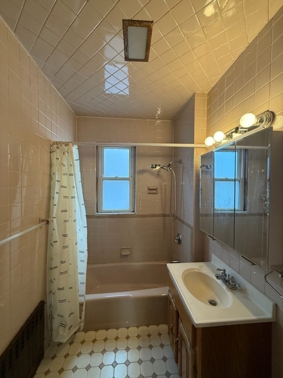 55-57 Evans Street Medford, MA 02155 - Photo 22 of 40 a bathroom with a sink a toilet and shower