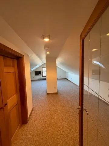 a view of hallway with stairs