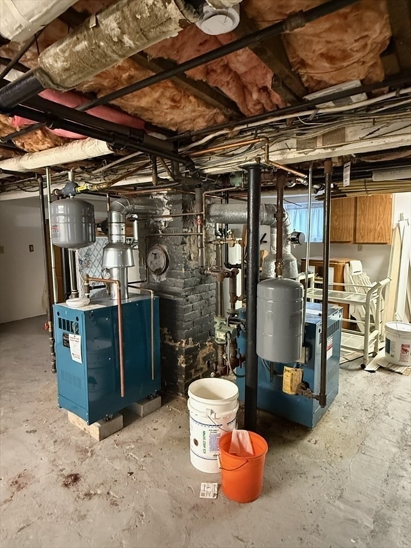 55-57 Evans Street Medford, MA 02155 - Photo 34 of 40 a view of a storage room with water heater