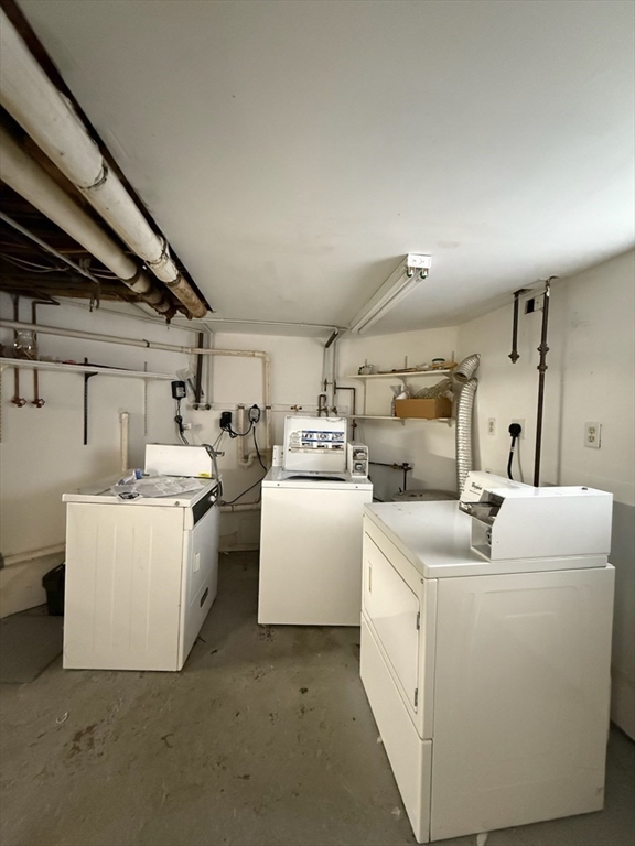 55-57 Evans Street Medford, MA 02155 - Photo 40 of 40 a utility room with dryer and washer