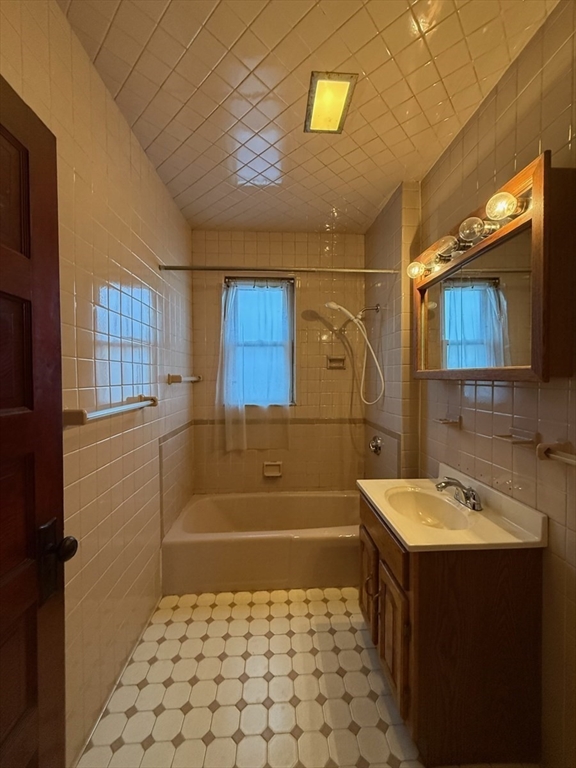 55-57 Evans Street Medford, MA 02155 - Photo 8 of 40 a bathroom with a sink a toilet and shower