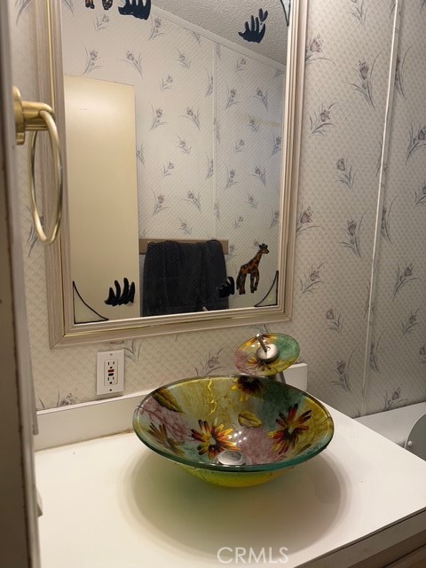 2500 North Highway 59, Unit 270 Merced, CA 95348 - Photo 6 of 14 a bathroom with a sink and a mirror