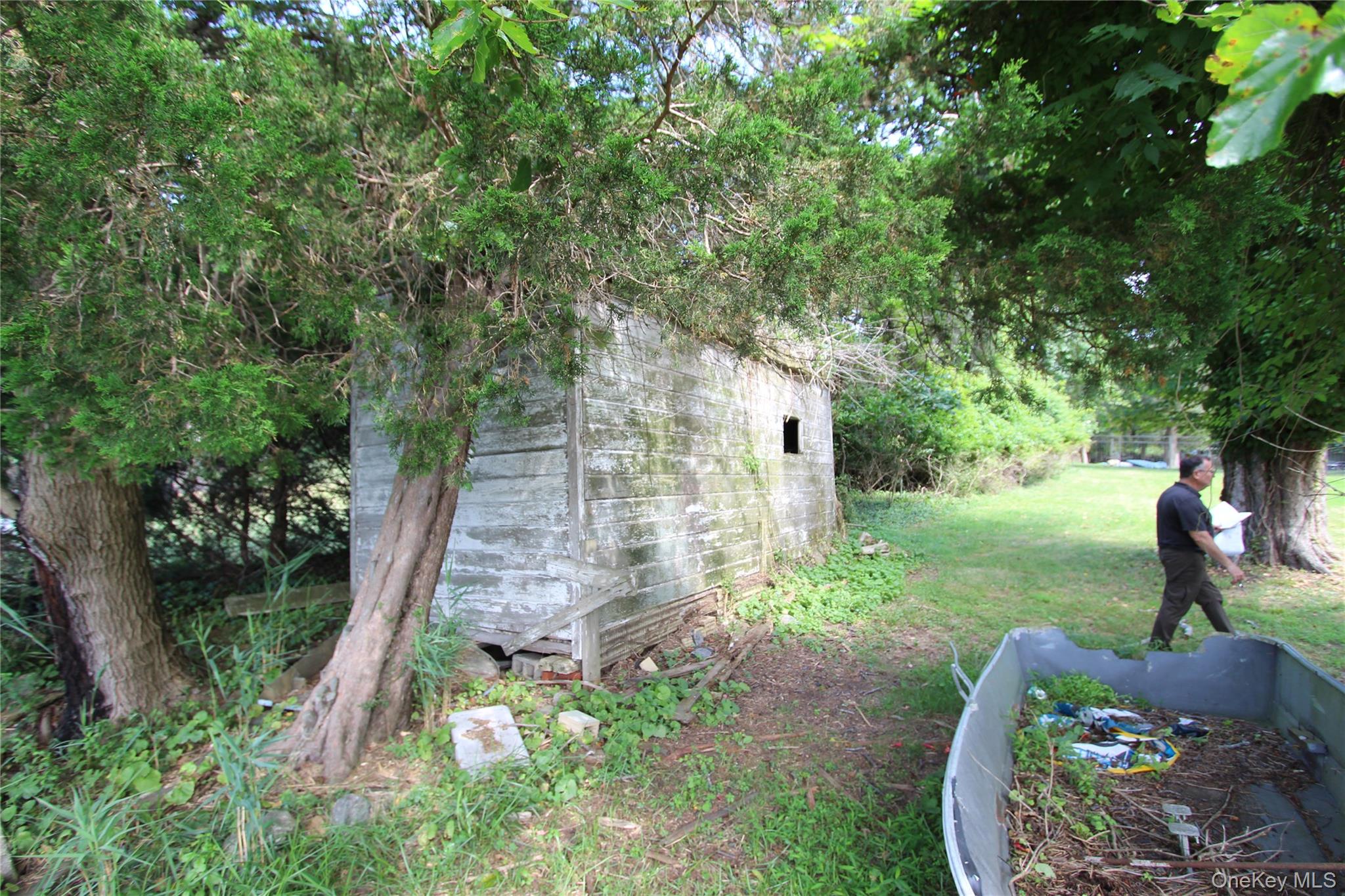 59 Dyke Road East Setauket, NY 11733 - Photo 16 of 21 a front view of a house with garden