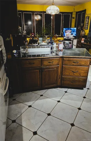 a kitchen with washing machine and a sink