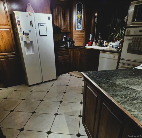 a living room with furniture and a lamp