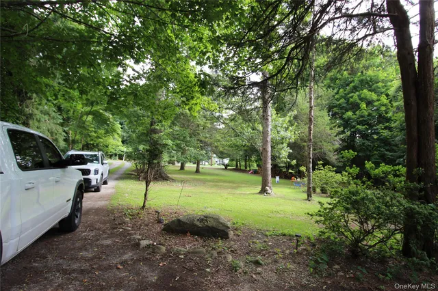 a car parked in front of a white house