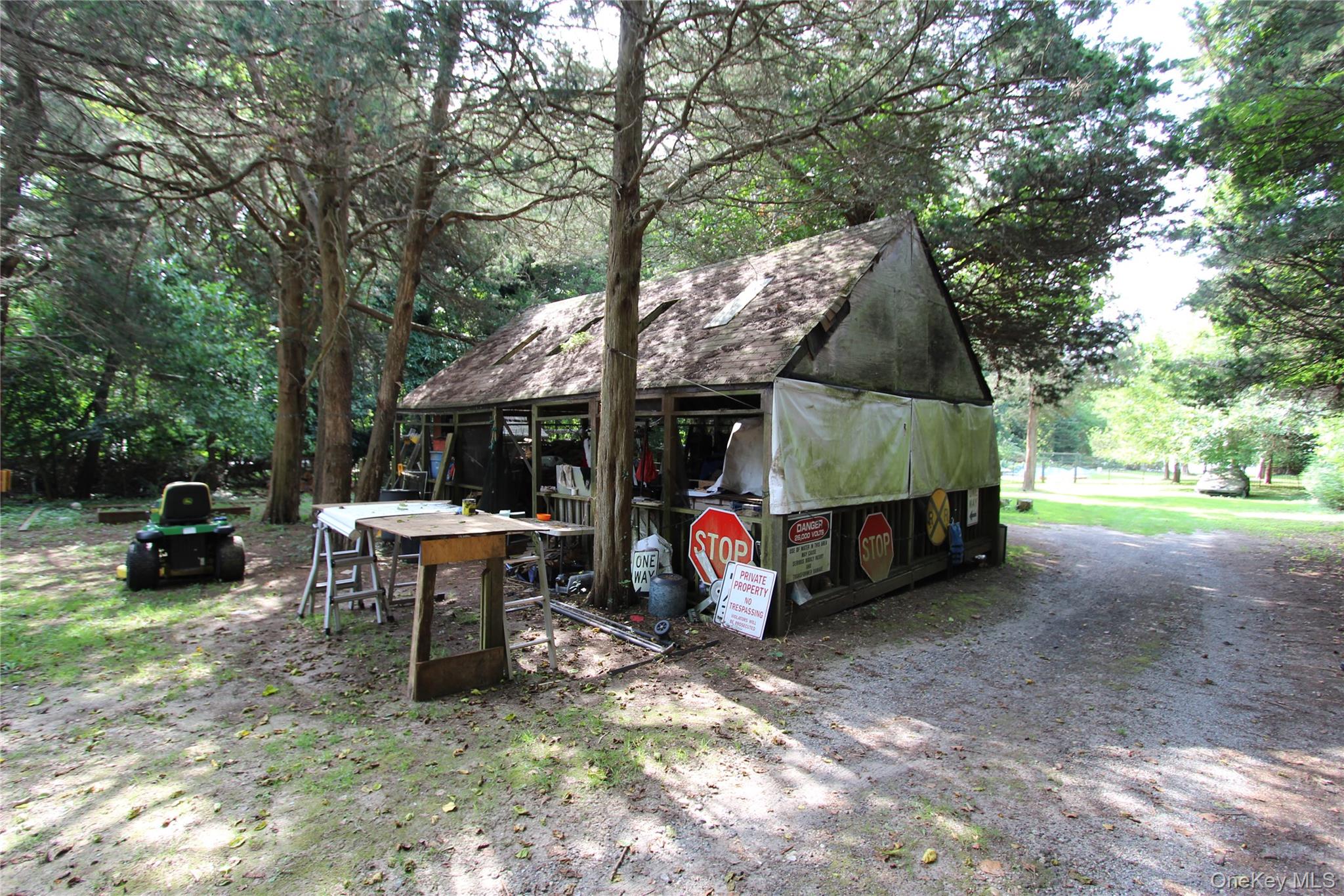 59 Dyke Road East Setauket, NY 11733 - Photo 6 of 21 a view of backyard with table and chairs a large and a large tree