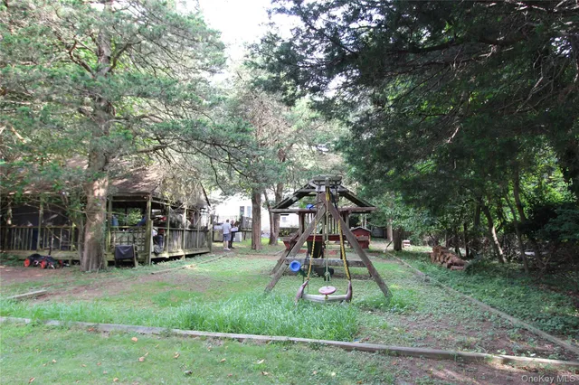 a view of a park with swings and slides