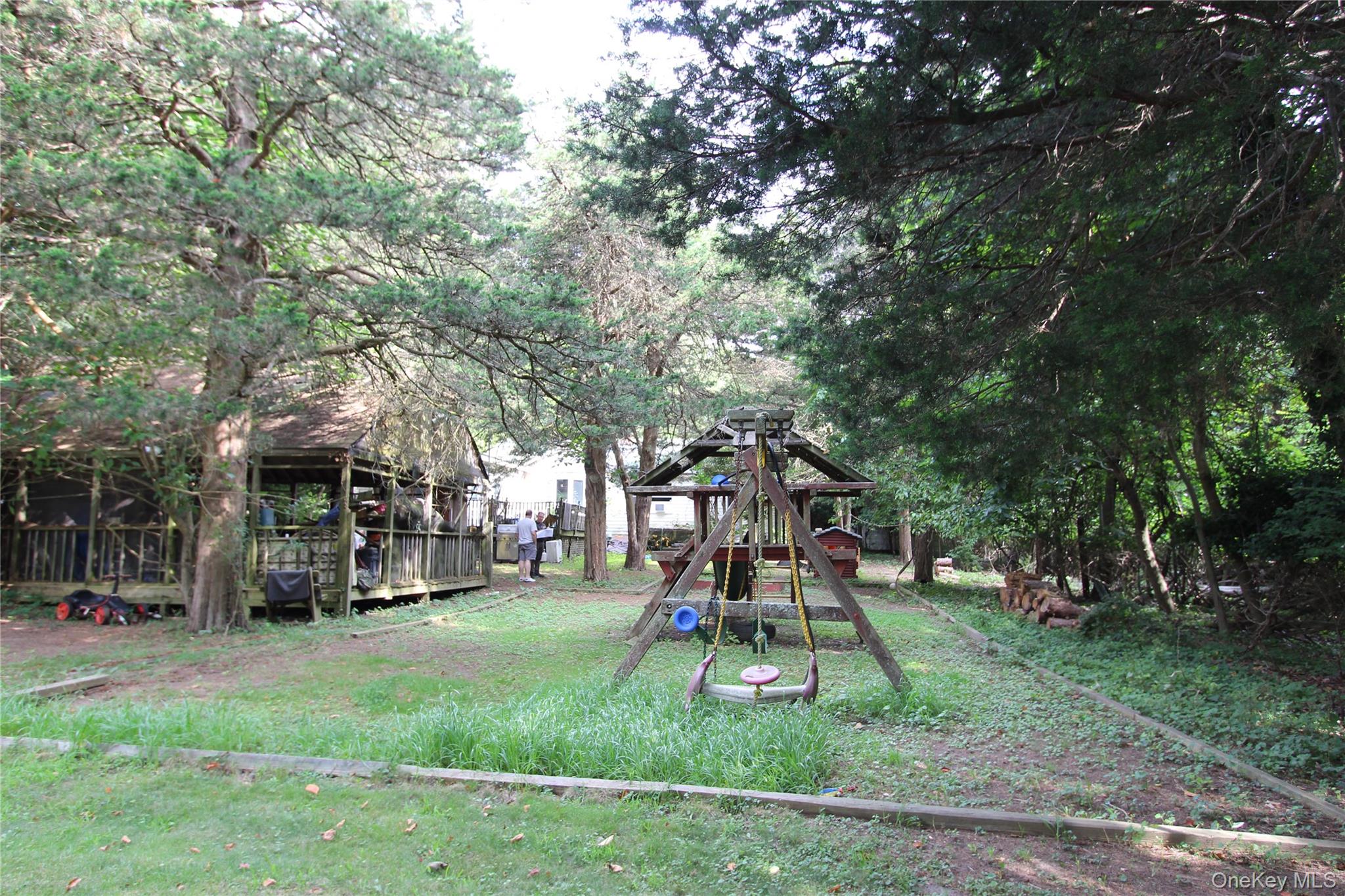 59 Dyke Road East Setauket, NY 11733 - Photo 7 of 21 a childrens park with lots of swings and slides