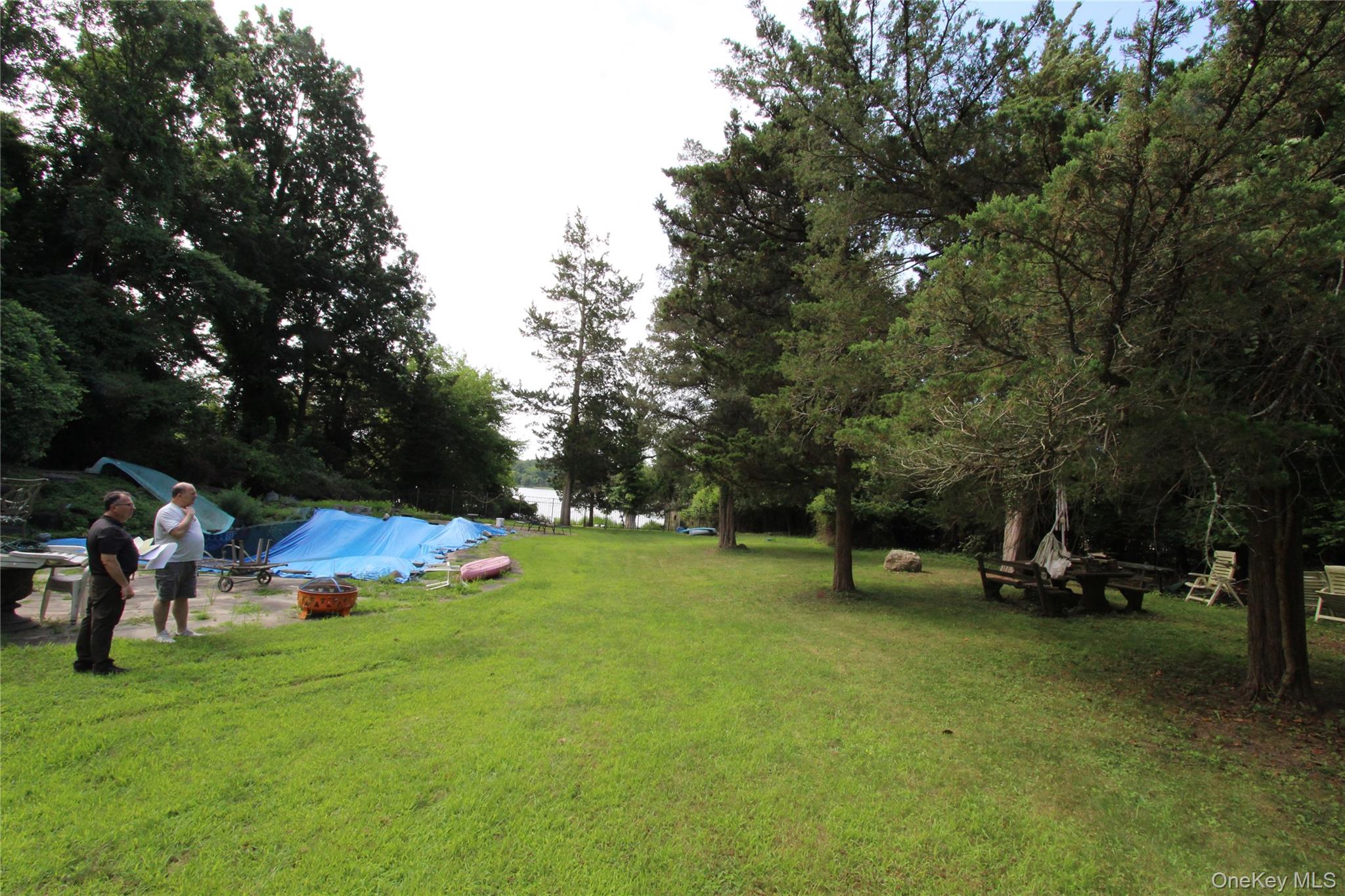 59 Dyke Road East Setauket, NY 11733 - Photo 8 of 21 a view of a park with swings and slides