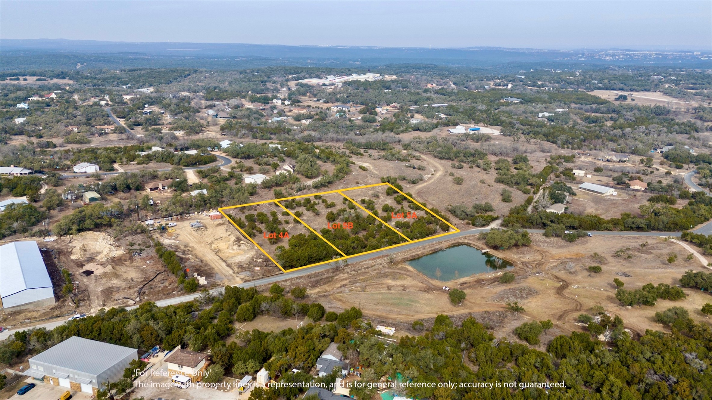 Aerial view of property and surrounding area with property boundaries highlighted