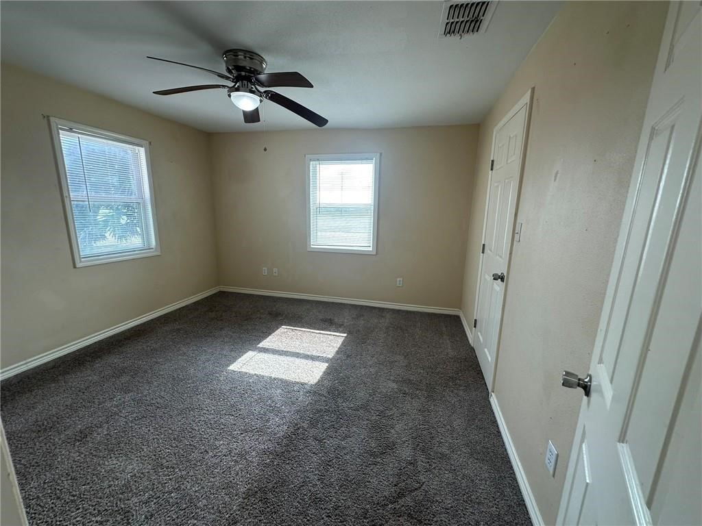104 2nd Street Gregory, TX 78374 - Photo 18 of 27 a view of a livingroom with a ceiling fan and window