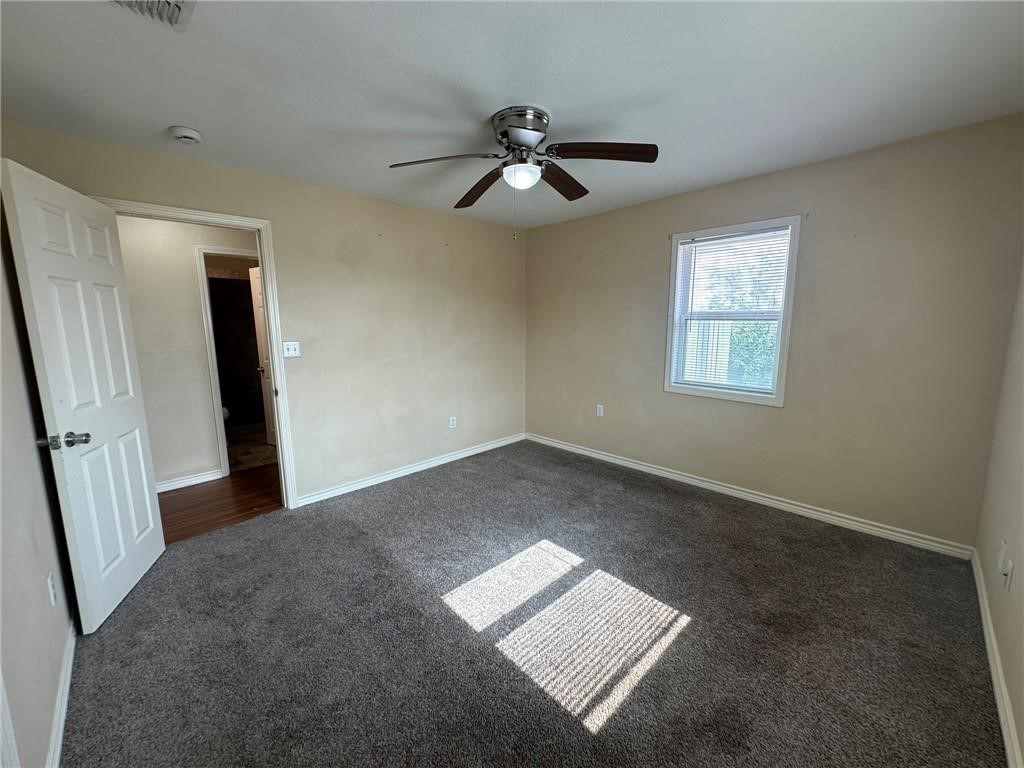 104 2nd Street Gregory, TX 78374 - Photo 20 of 27 wooden floor in an empty room with a window
