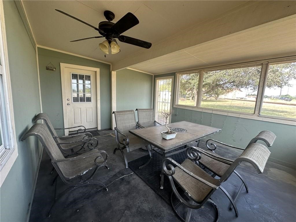 104 2nd Street Gregory, TX 78374 - Photo 27 of 27 a view of a workspace with furniture and a large window