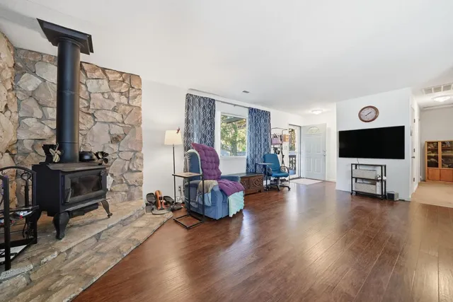 a view of a livingroom with furniture and a flat screen tv