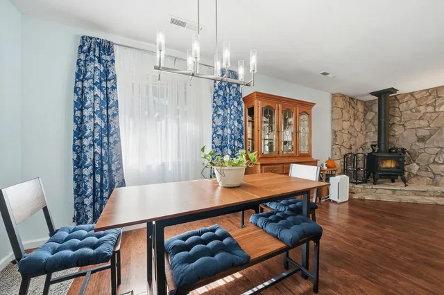 a view of a dining room with furniture window and wooden floor