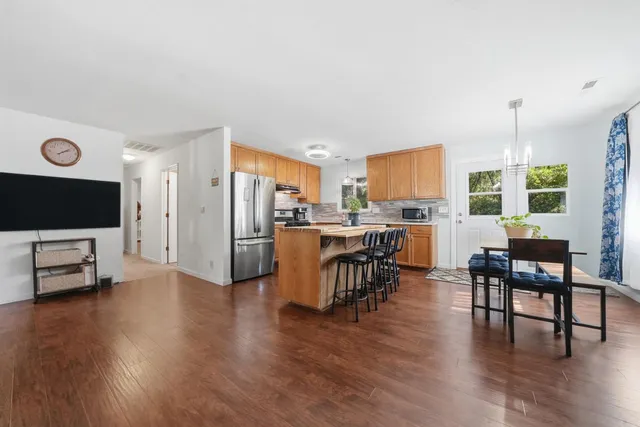 a view of a dining room with furniture window and wooden floor