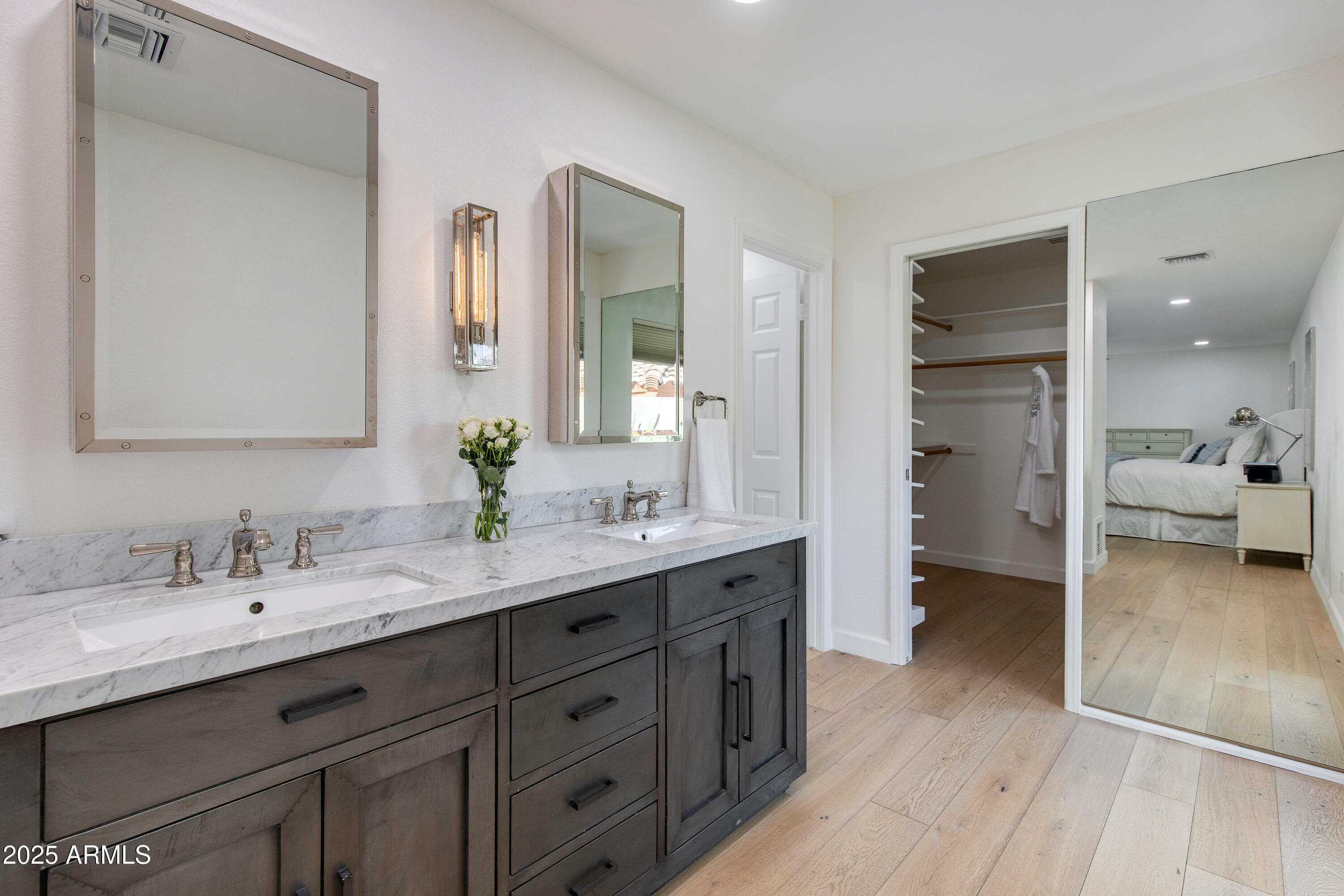 3116 East Rose Lane Phoenix, AZ 85016 - Photo 10 of 24 a en suite bathroom with a double vanity sink and a mirror