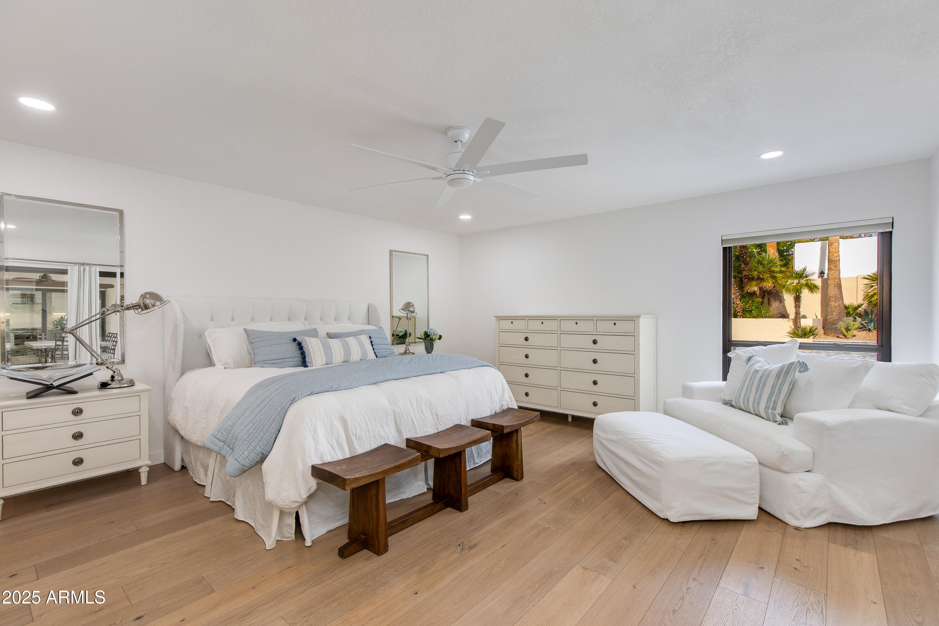 3116 East Rose Lane Phoenix, AZ 85016 - Photo 9 of 24 a spacious bedroom with a bed and a couch