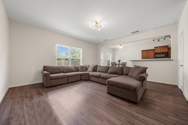 1327 Diamond Drape Drive Rosharon, TX 77583 - Photo 3 of 26 a living room with furniture and a wooden floor