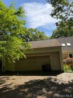 1117 Cedar Ridge Road Oyster Bay, NY 11771 - Photo 37 of 41 a front view of a house with a yard