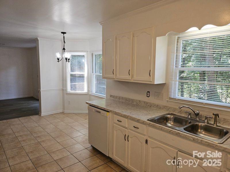 2819 Royal Ridge Lane Charlotte, NC 28212 - Photo 4 of 15 a kitchen with granite countertop a sink stove and cabinets