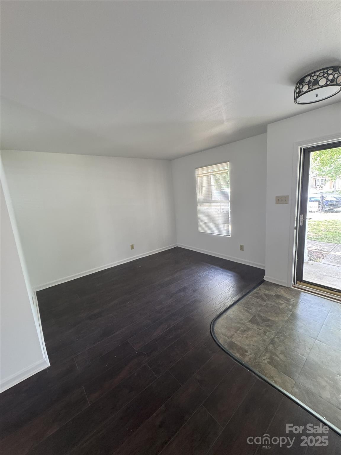 2819 Royal Ridge Lane Charlotte, NC 28212 - Photo 7 of 15 an empty room with wooden floor and windows