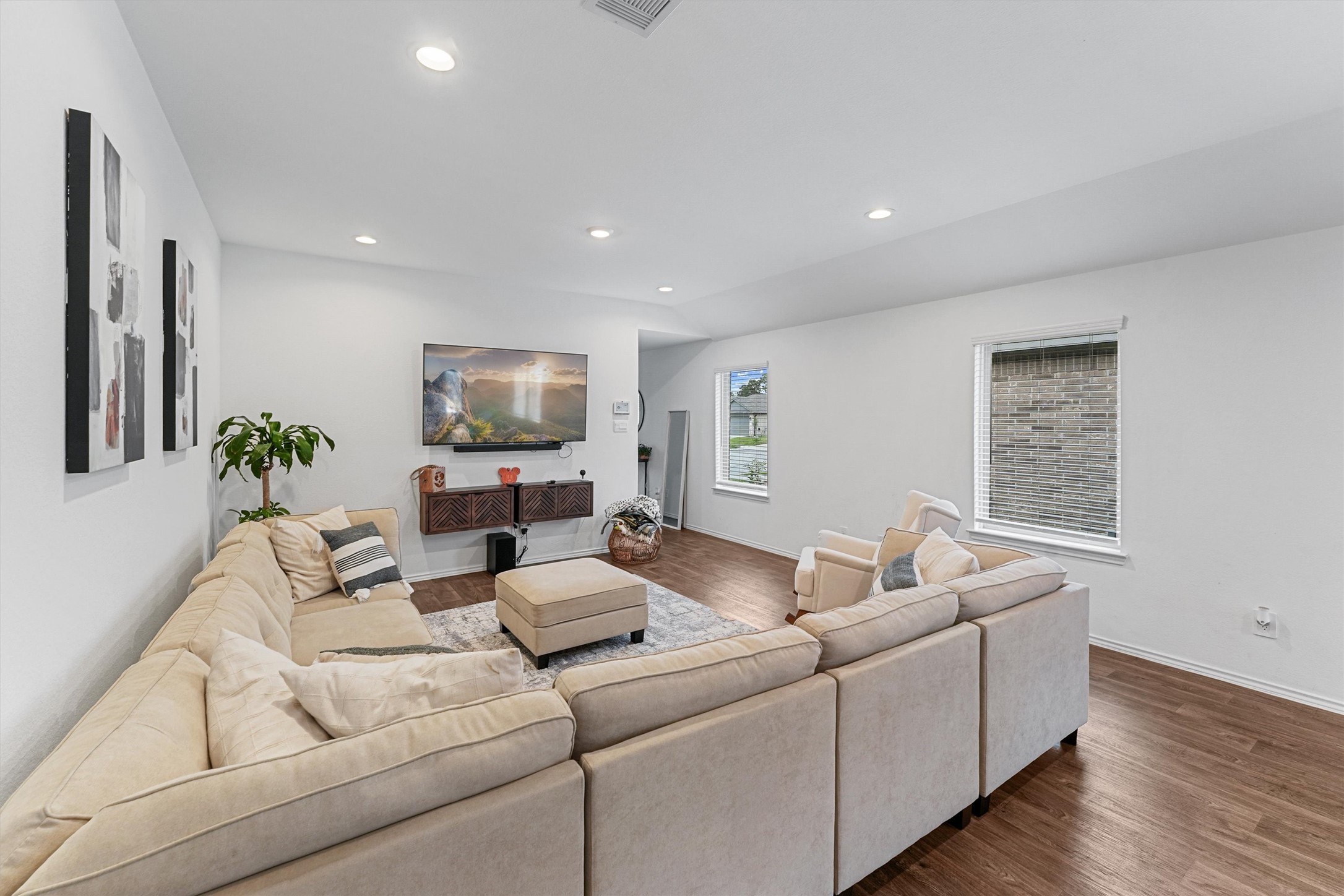 22411 Gilded Peak Lane Spring, TX 77373 - Photo 7 of 16 a living room with furniture and a flat screen tv