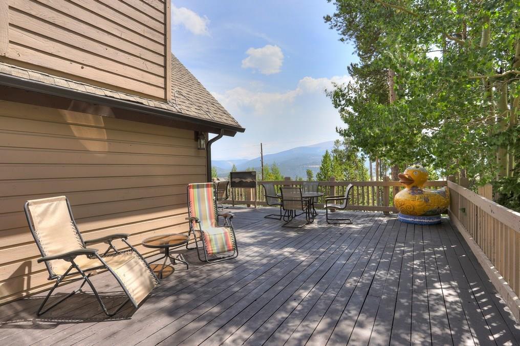 213 4 O'Clock Run Road Breckenridge, CO 80424 - Photo 3 of 34 a view of a patio with table and chairs and wooden floor