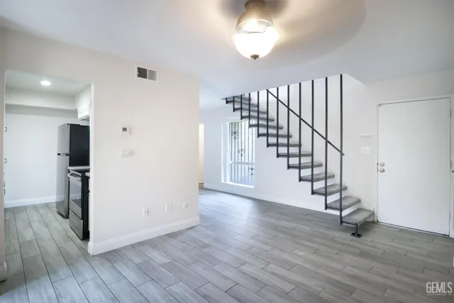 a view of entryway with wooden floor