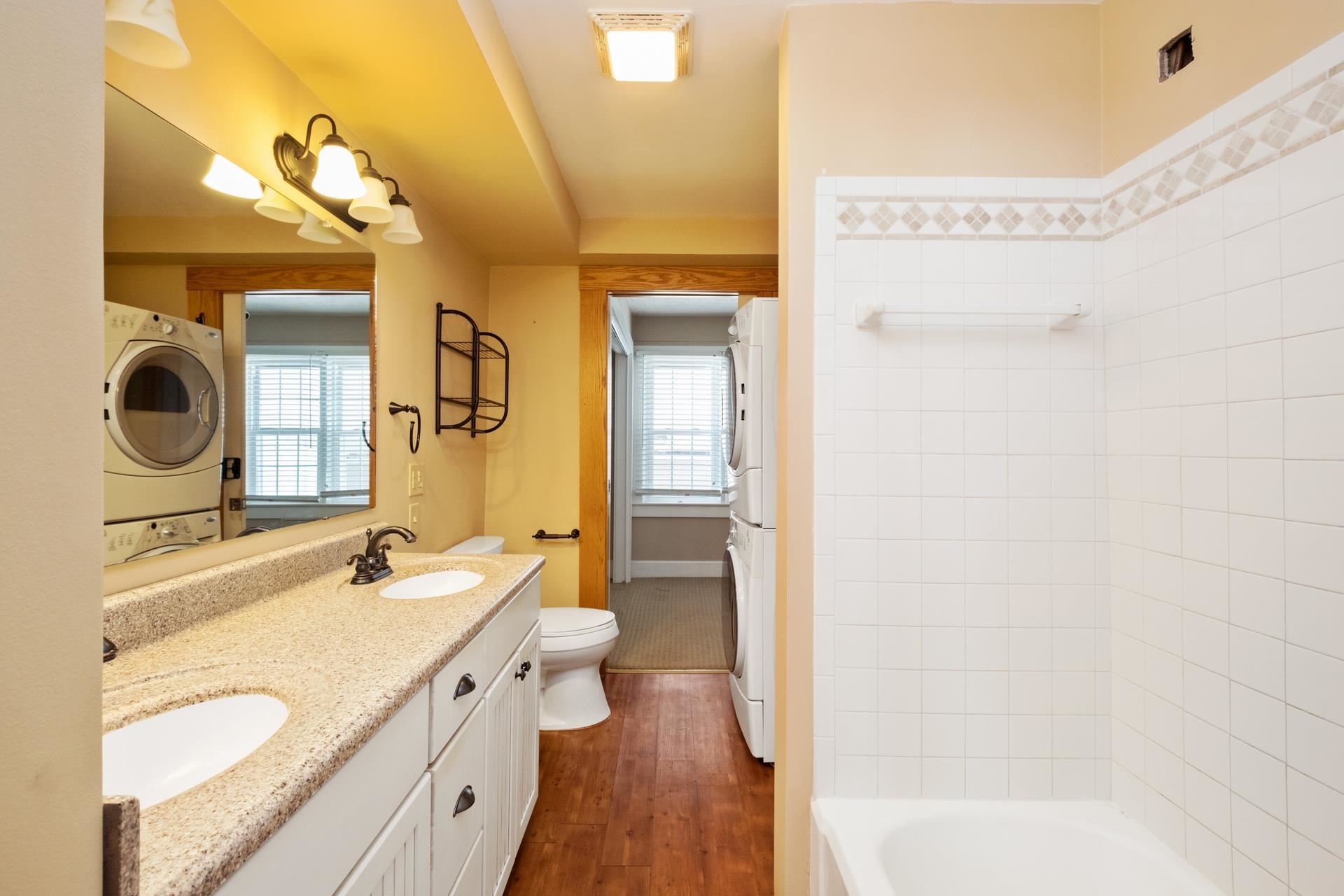 7720 Port Republic Road Port Republic, VA 24471 - Photo 29 of 35 a bathroom with a granite countertop sink mirror and a bathtub
