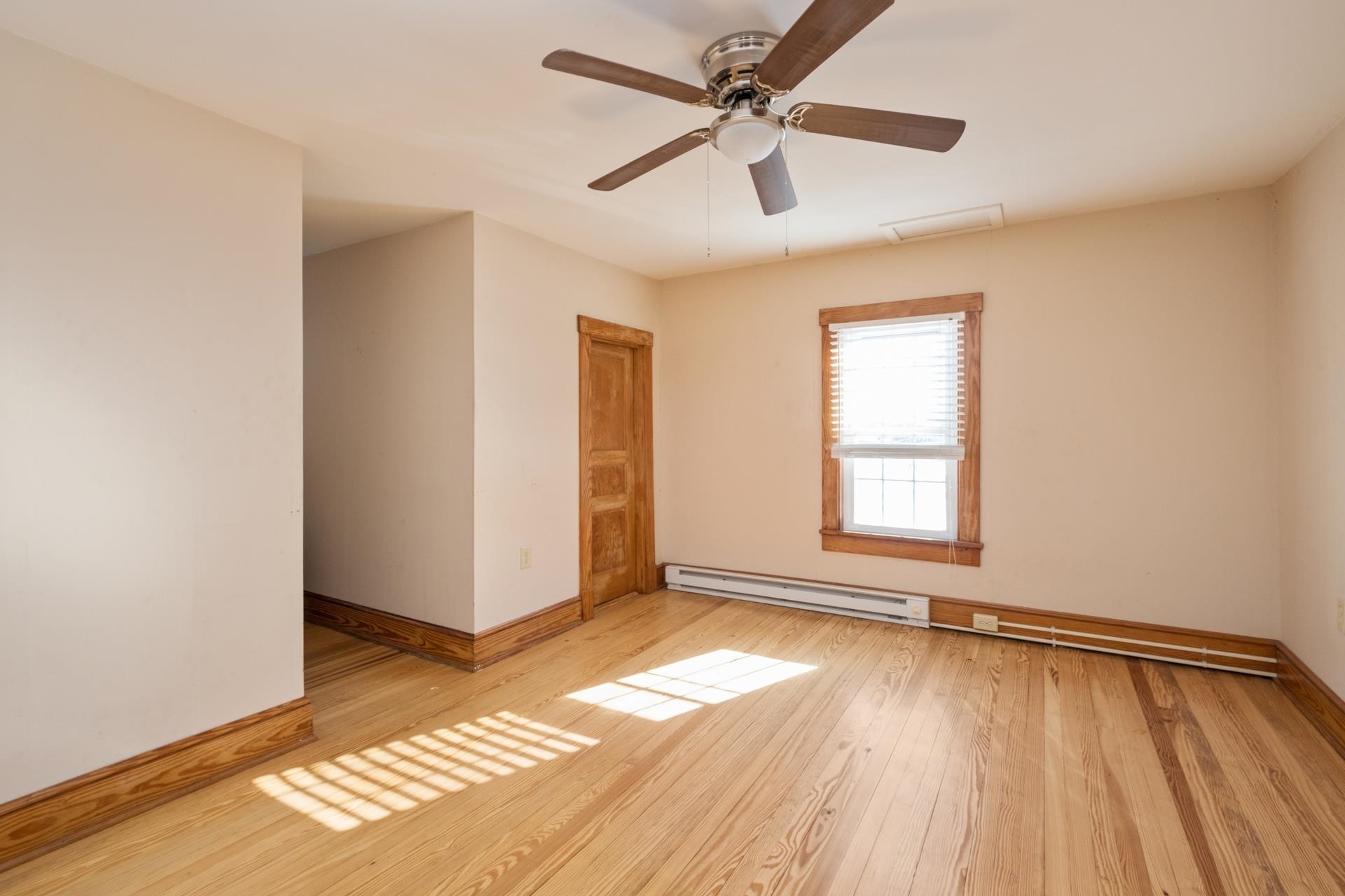 7720 Port Republic Road Port Republic, VA 24471 - Photo 33 of 35 an empty room with wooden floor fan and windows