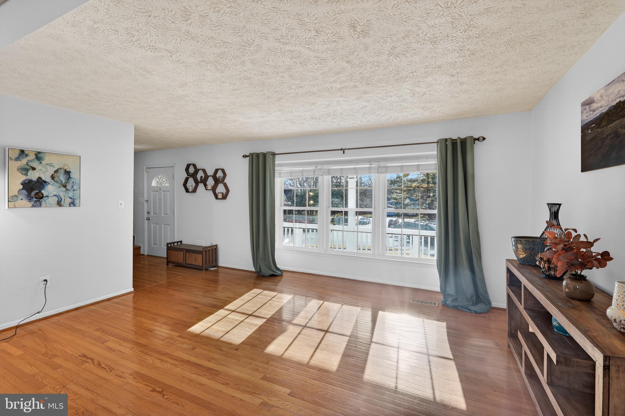 7200 Beachway Court Springfield, VA 22153 - Photo 11 of 31 a living room with furniture and a floor to ceiling window